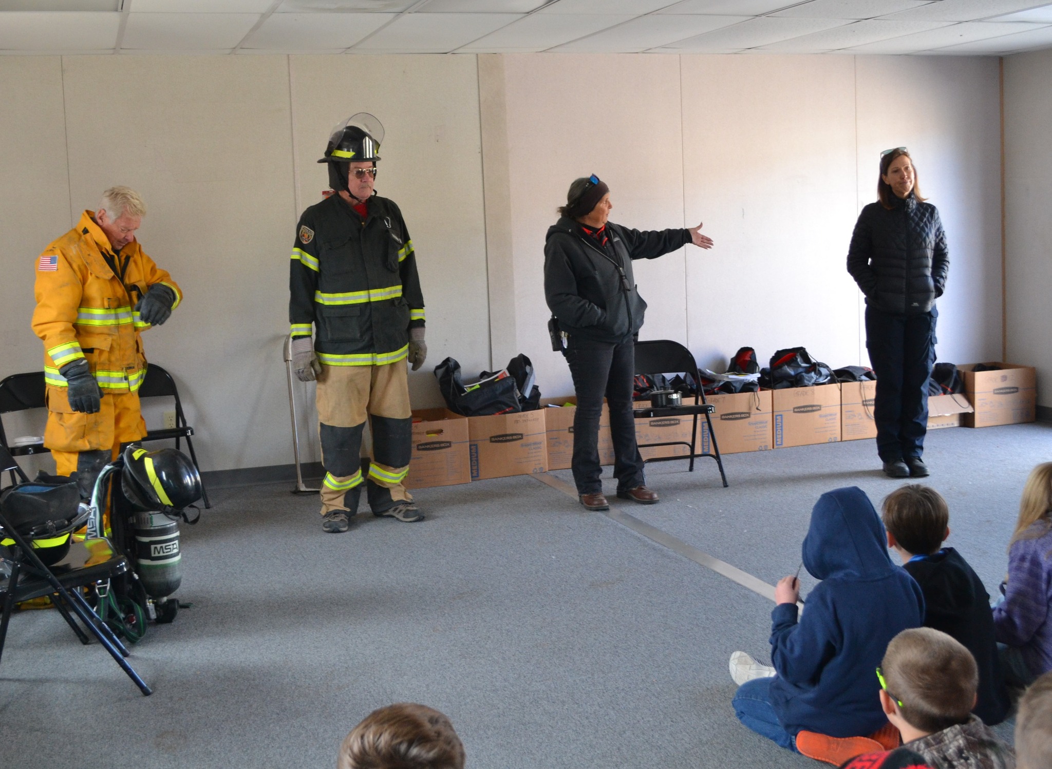 Chief Susan at the Lake George Charter School, introducing the team from the Lake George Fire Prevention District, during a fire prevention and safety event.