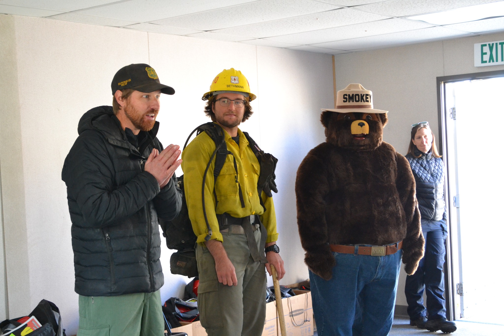 Firefighters and Smokey the Bear, at the Lake George Charter School during a fire prevention and safety event.