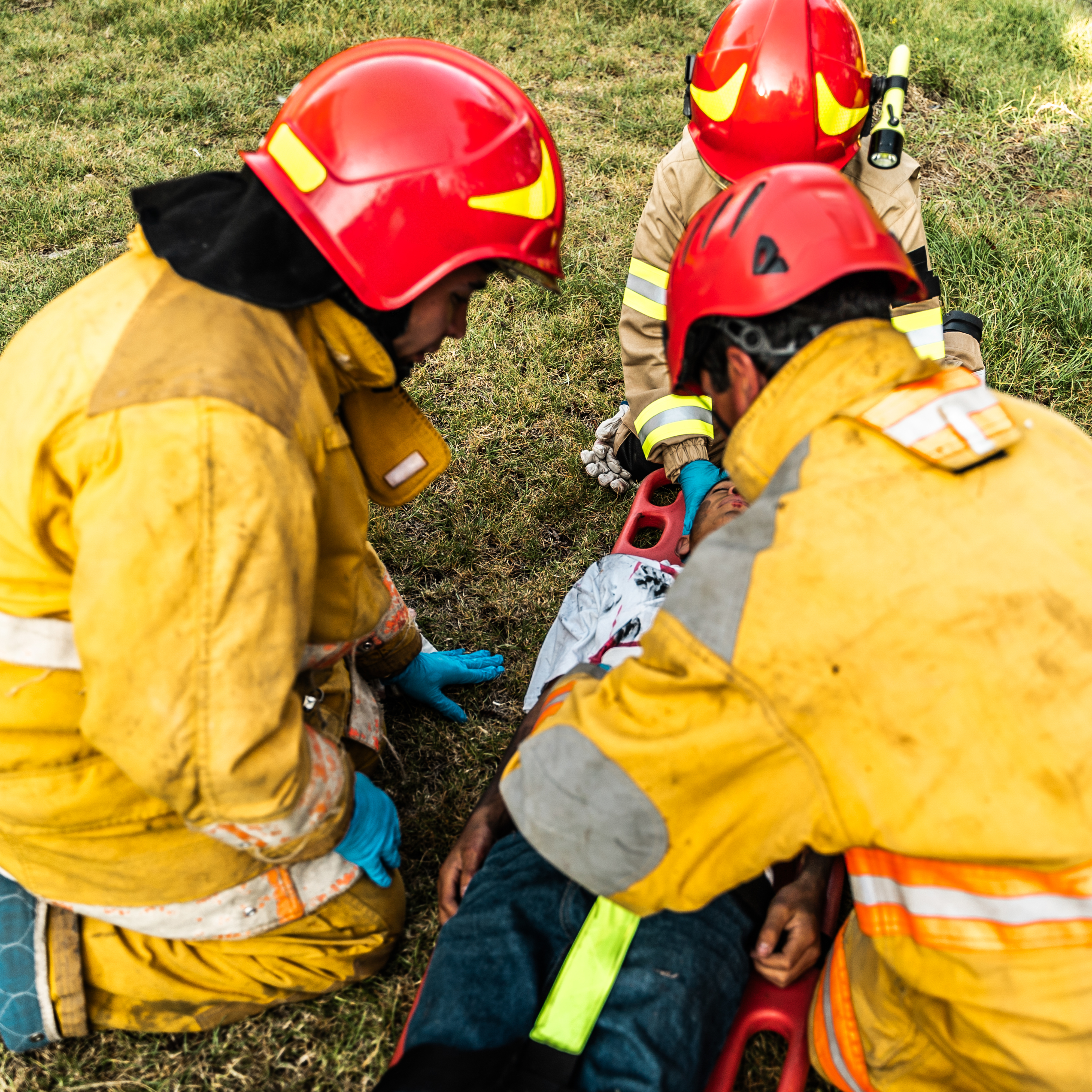 Firefighters helping a victim, medical intervention